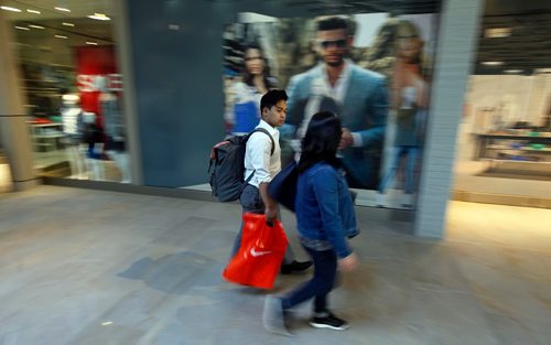 PHIL HOSSACK / WINNIPEG FREE PRESS  -  Shoppers stroll through the new Outlet Collection Mall on Sterling Lyon Drive Wednesday afternoon during the mall's opening day. See story.  -  May 3, 2017