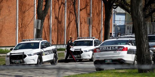 PHIL HOSSACK / WINNIPEG FREE PRESS  -  Police vehicles line Church ave in front of St Johns High School Thursday afternoon after a critical incident led to a lock down. See story.  -  May 4, 2017