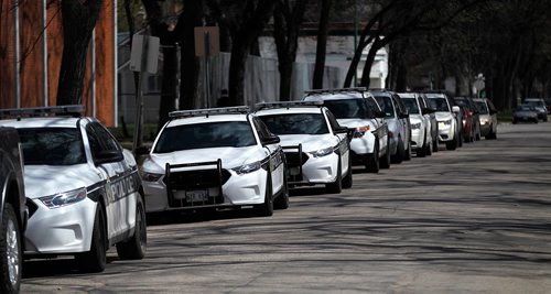 PHIL HOSSACK / WINNIPEG FREE PRESS  -  Police vehicles line Church ave in front of St Johns High School Thursday afternoon after a critical incident led to a lock down. See story.  -  May 4, 2017