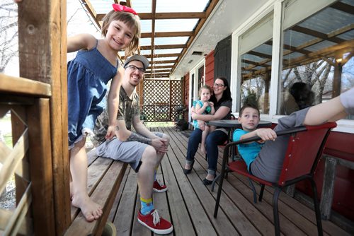 RUTH BONNEVILLE /  WINNIPEG FREE PRESS

Gretna MB
Family living in Gretna near the seniors home are happy the community is doing what it can to help the new asylum seekers,  Photo taken in their home and on front deck.  Names of family members: Madison Sawatzky (dad), Ayden (7yrs, boy), Ruby (5yrs), Lylah (almost 3yrs) and mom Amanda Sawatzky.  
The province opens a temporary shelter for refugee claimants near the border in Gretna to ease the flow of asylum seekers arriving in Winnipeg at all hours needing housing and help.
Gretna's former seniors home that has been sitting vacant is being repurposed to house asylum seekers for a few days before they can move on to more long-term shelter in Winnipeg. 
See Jane Gerster story.  



May 04, 2017