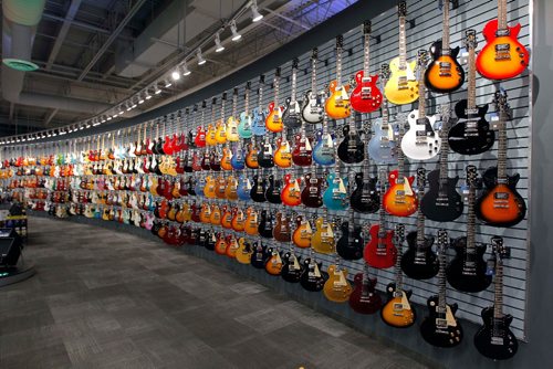 BORIS MINKEVICH / WINNIPEG FREE PRESS
Long & McQuades new flagship Winnipeg store. There is a wall of guitars in the store. For Mondays real estate column. Murray McNeill story. May 5, 2017