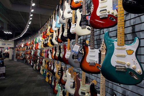 BORIS MINKEVICH / WINNIPEG FREE PRESS
Long & McQuades new flagship Winnipeg store. There is a wall of guitars in the store. For Mondays real estate column. Murray McNeill story. May 5, 2017