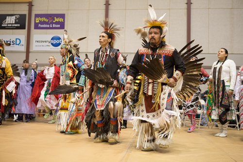JEN DOERKSEN/WINNIPEG FREE PRESS
Traditional dancers followed the grads and encircled them during the first grand entry at University of Manitobas Annual Traditional Graduation Pow Wow. Saturday, May 6, 2017.