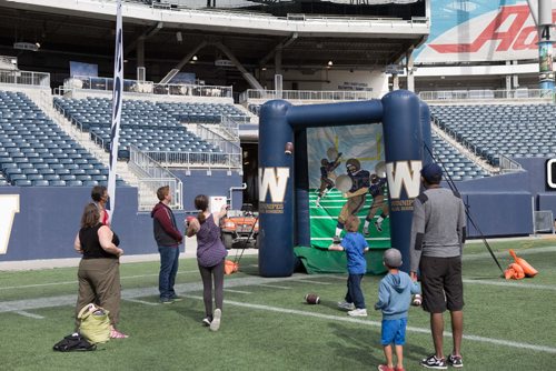 JEN DOERKSEN/WINNIPEG FREE PRESS
Young athletes and families were welcomed onto the field at Investors Group Field to hone their football skills. Saturday, May 6, 2017.