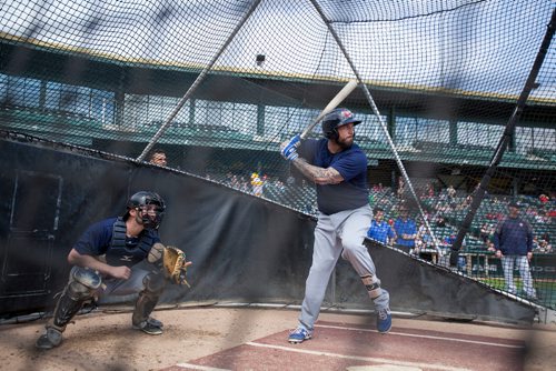 First baseman David Bergin (#13) at bat during the Winnipeg Goldeyes Open House at Shaw Park. Goldeyes' manager Rick Fortney can be seen in the background at right. Saturday, May 6, 2017. Copyright Jessica Finn for the Winnipeg Free Press.