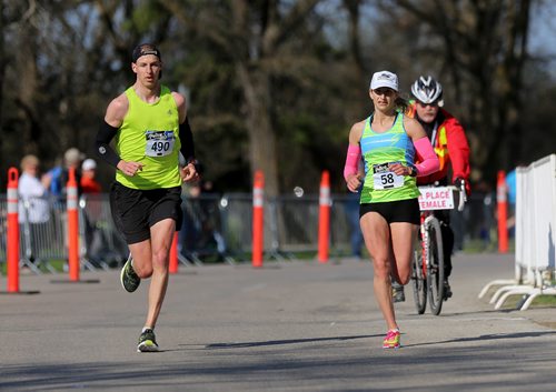 TREVOR HAGAN / WINNIPEG FREE PRESS
Jeremy and Nicole Walker approach the finish line. Jeremy would finish as the 5th fastest male and Nicole was the fastest female in the half. The 13th annual Winnipeg Police Service Half Marathon started and finished in Assiniboine Park, Sunday, May 7, 2017.