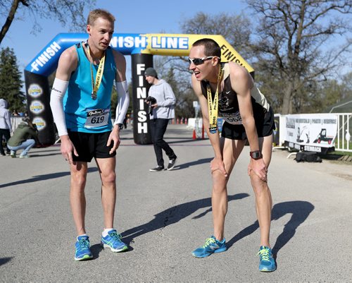 TREVOR HAGAN / WINNIPEG FREE PRESS
The 13th annual Winnipeg Police Service Half Marathon started and finished in Assiniboine Park, Sunday, May 7, 2017. Brian Walker, left finished first, and Nickolas Kosmenko, right, finished second.