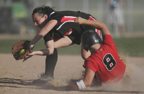 John Woods / Winnipeg Free Press / August 17/08 - 080817  - Ashley Jaffray (9) of the Smitty's Senior A-2 team attempts to tag out Holly Kitchen (8) of the Smitty's Senior A team at the 2008 Senior Women's Canadian Fast Pitch Championships in Winnipeg Sunday August 17, 2008.