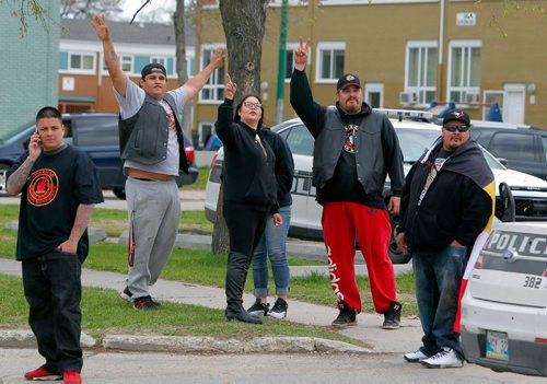BORIS MINKEVICH / WINNIPEG FREE PRESS
Police at The Indian and Métis Friendship Centre of Winnipeg Inc. on 45 Robinson Street. in this photo a group from the American Indian Movement wave to an eagle flying overhead. CAROL SANDERS STORY. May 8, 2017