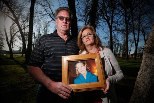 JOHN WOODS / WINNIPEG FREE PRESS
Amber McFarland's mother Lori and father Scott McFarland are photographed with a portrait of Amber in Portage La Prairie Tuesday, May 9, 2017.  Amber was last seen in Portage La Prairie on security camera footage during the early morning of October 18, 2008.