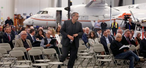 WAYNE GLOWACKI / WINNIPEG FREE PRESS 

Michael Pyle, CEO  walks to the podium at the Exchange Income Corp. annual meeting held in the Calm Air hangar Wednesday. 
Martin Cash  story  May 10 2017