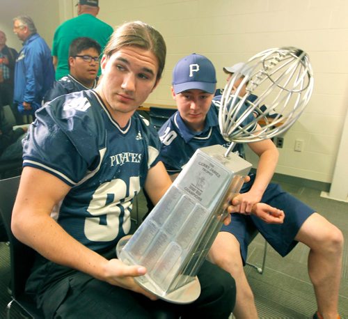 BORIS MINKEVICH / WINNIPEG FREE PRESS
From left, Nick Rooswinkel and Geno Bruning-Haid of the Grant park Raiders with the Gerry James trophy at the Blue Bombers media room at Investors Group Field. The 2017 Senior Bowl, showcasing the best graduating high school football players from across Manitoba and western Ontario, is set for Investors Group Field on Saturday, May 13th at 10:00 a.m. May 10, 2017
