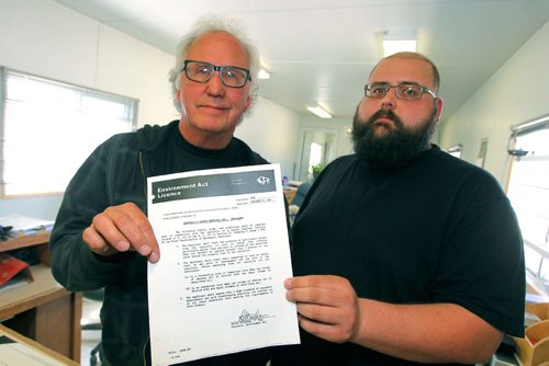 BORIS MINKEVICH / WINNIPEG FREE PRESS
From left, Lenn Samborski and son Paul hold a copy of an old document form Manitoba Environment. Photo taken at their 132 Samborski Drive business location. May 10, 2017