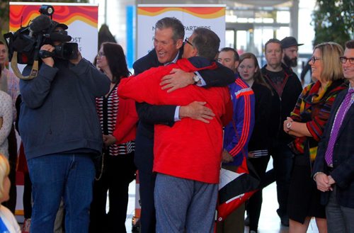 BORIS MINKEVICH / WINNIPEG FREE PRESS
CANADA GAMES TORCH RELAY EVENT - The 2017 Canada Games Host Society had an event at MB Hydro headquarters to honour and celebrate individuals who will carry the Roly McLenahan Torch, as part of the Manitoba Hydro Torch Relay. Dancing Gabe, in red, gets a big hug by Manitoba Premier Brian Pallister.  CAROL SANDERS STORY. May 12, 2017