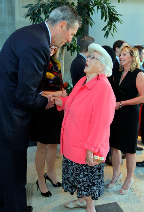 BORIS MINKEVICH / WINNIPEG FREE PRESS
CANADA GAMES TORCH RELAY EVENT - The 2017 Canada Games Host Society had an event at MB Hydro headquarters to honour and celebrate individuals who will carry the Roly McLenahan Torch, as part of the Manitoba Hydro Torch Relay. From left, Manitoba Premier Brian Palmister congratulates Jean Morrison. She and more than 200 others across Manitoba have been selected as torchbearers for the 2017 Canada Summer Games in Winnipeg. The torch relays take place from June 23 to July 28; the games run from July 28 to Aug. 13.  CAROL SANDERS STORY. May 12, 2017