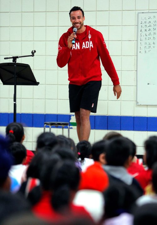 BORIS MINKEVICH / WINNIPEG FREE PRESS
O.V. Jewitt School in the Seven Oaks School Division celebrated the success of former student named Justin Duff who recently played volleyball for Team Canada at the Olympics in Rio. Here Justin Duff has some fun talking to the kids the assembly. JASON BELL STORY. May 12, 2017