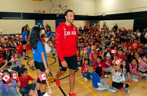 BORIS MINKEVICH / WINNIPEG FREE PRESS
O.V. Jewitt School in the Seven Oaks School Division celebrated the success of former student named Justin Duff who recently played volleyball for Team Canada at the Olympics in Rio. Here Justin Duff enters the assembly as kids from the school cheer on. JASON BELL STORY. May 12, 2017