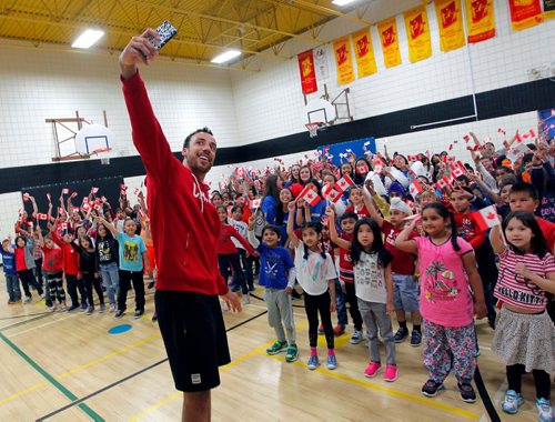 BORIS MINKEVICH / WINNIPEG FREE PRESS
O.V. Jewitt School in the Seven Oaks School Division celebrated the success of former student named Justin Duff who recently played volleyball for Team Canada at the Olympics in Rio. Here Justin Duff takes a selfie with the the kids at the assembly. JASON BELL STORY. May 12, 2017