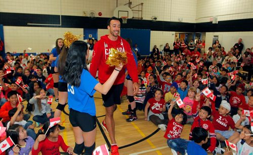 BORIS MINKEVICH / WINNIPEG FREE PRESS
O.V. Jewitt School in the Seven Oaks School Division celebrated the success of former student named Justin Duff who recently played volleyball for Team Canada at the Olympics in Rio. Here Justin Duff enters the assembly as kids from the school cheer on. JASON BELL STORY. May 12, 2017