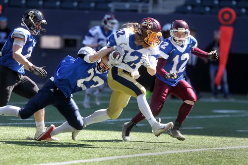 RUTH BONNEVILLE /  WINNIPEG FREE PRESS

Gage Foster #12 on the Kapilik team (white)  manages to hold onto the ball while Matt Strachan #23 Boyd team (blue) tries to tackle him during the 1st half of the WHSFL's (Winnipeg High School Football League) Senior Bowl at Investors Group Field Saturday morning.  

See sports reporter.  




May 13, 2017