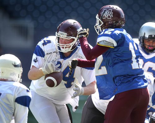 RUTH BONNEVILLE /  WINNIPEG FREE PRESS

Chris Calder #34 on the Kapilik team (white) tries to get back control of the ball during game against Boyd team (blue) in the 1st half of the WHSFL's (Winnipeg High School Football League) Senior Bowl at Investors Group Field Saturday morning.  

See sports reporter.  




May 13, 2017