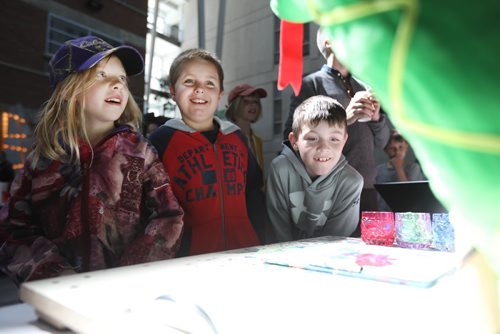 RUTH BONNEVILLE /  WINNIPEG FREE PRESS

SCIENCE RENDEZVOUS -  U of M, 
Marika Banack-Foster (9yrs) her brother Alex Banack-Foster (9yrs, red) and Rhett Huntley (8yrs) watch Pic-a-snake, a robotic stuffed snake that paints pictures from the sound waves in songs set up at the computer programming booth, one of many teaching tables at the SCIENCE RENDEZVOUS at U of M Saturday.

May 13, 2017