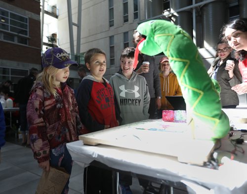 RUTH BONNEVILLE /  WINNIPEG FREE PRESS

SCIENCE RENDEZVOUS -  U of M, 
Marika Banack-Foster (9yrs) her brother Alex Banack-Foster (9yrs, red) and Rhett Huntley (8yrs) watch Pic-a-snake, a robotic stuffed snake that paints pictures from the sound waves in songs set up at the computer programming booth, one of many teaching tables at the SCIENCE RENDEZVOUS at U of M Saturday.

May 13, 2017