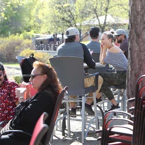 RUTH BONNEVILLE /  WINNIPEG FREE PRESS

People take advantage of the warm, sunny weather to sit out on the patios at the Forks Saturday.
Standup pic 

May 13, 2017