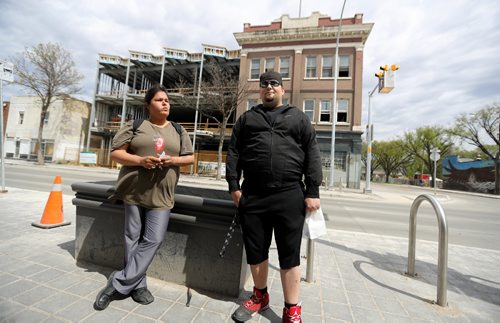 TREVOR HAGAN / WINNIPEG FREE PRESS
Rhonda Bruce and Steven Reinheimer, across from the Merchant Corner where a fire took place Friday night, Sunday, May 14, 2017.
