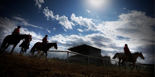 JOHN WOODS / WINNIPEG FREE PRESS
Pony riders head to the paddock during opening day of racing at Assiniboia Downs Sunday, May 14, 2017.
