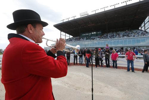 JOHN WOODS / WINNIPEG FREE PRESS
Bugler Bob vandenBroek plays to signal the start of a race at opening day of racing at Assiniboia Downs Sunday, May 14, 2017.