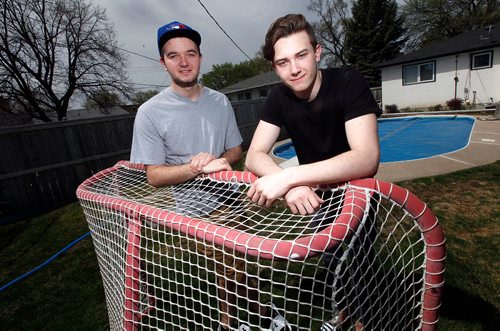 PHIL HOSSACK / WINNIPEG FREE PRESS  -  NHL draft prospect Cody Glass (right) poses with his brother Matthew poses with a back yard hockey goal they use to play backyard shiny with at his West Kildonan home Monday. See Mike Sawatzsky'sstory.  -  May 15, 2017