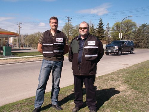 Canstar Community News (From left) Trevor Siwak and Dean Jones are volunteers with the North Kildonan Community Watch. (SHELDON BIRNIE/CANSTAR/THE HERALD)