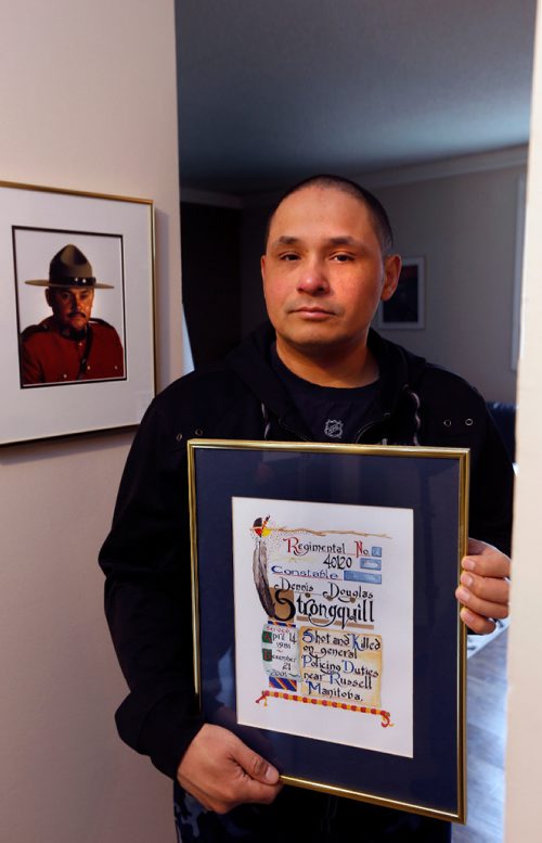 WAYNE GLOWACKI / WINNIPEG FREE PRESS

Saturday Special. Ricky Strongquill, the son of RCMP Const. Dennis Strongquill. He is holding an artwork presented to the family by the  RCMP to honour the memory of  Dennis Strongquill.  Dennis Strongquill was a 52-year-old constable stationed in Waywayseecappo just before Christmas of 2001, when he was shot to death during a routine traffic stop just east of Russell.  Mike McIntyre story. May 16 2017