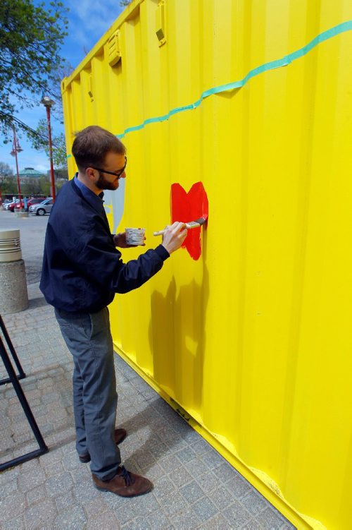 BORIS MINKEVICH / WINNIPEG FREE PRESS
WAG volunteer Aaron McMahon paints a metal shipping container at The Forks this afternoon. ART EXPRESSD / ART EXPRIMÉ by The Winnipeg Art Gallery. INFO FROM WEBSITE: May 15-22 | 10 am  8 pm 
Location: The Forks National Historic Site - Parks Canada

The Winnipeg Art Gallery is celebrating Canada 150 with ART EXPRESSD, a coast-to-coast-to-coast adventure. Three 20-foot shipping containers transformed into mobile art studios will traverse every province and territory.

Before they set off on their journey, the containers will be painted with the help of Art City and Graffiti Art Programming. Stop by the Forks to find out more about this Canada 150 Signature Initiative. . May 17, 2017