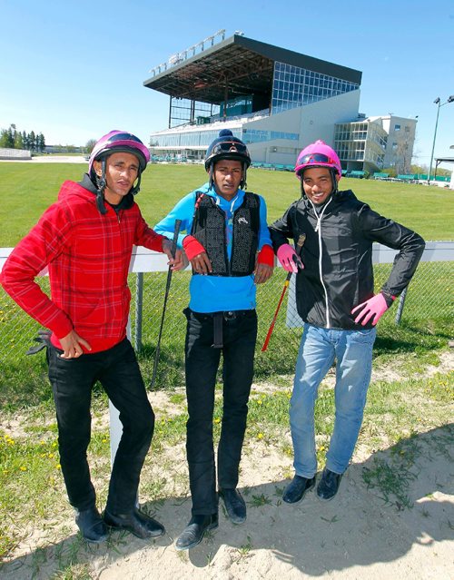 BORIS MINKEVICH / WINNIPEG FREE PRESS
New jockey's pose for a photo at Assiniboia Downs. From left, Preyven Badrie, Kerron Khelawan, and Stanley Chadee Jr.   GEORGE WILLIAMS STORY. May 18, 2017