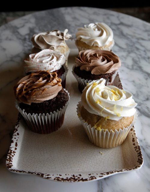PHIL HOSSACK / WINNIPEG FREE PRESS  -  Cocoabeans Restaurant Review - Fresh baked cupcakes wait to be taken home or eaten in.....Alison Gilmore tale.!  -  May 19,  2017