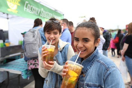 RUTH BONNEVILLE /  WINNIPEG FREE PRESS

Gianina Beauregard (right, front) and her friend Allana Fletcher enjoy one of their favourite drinks, fresh lemon iced tea, on the opening day of the St. Norbert Farmer's Market  Saturday morning. 

Standup photo 


May 20, 2017