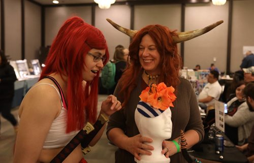 RUTH BONNEVILLE /  WINNIPEG FREE PRESS

Winona Casavant checks out a cool fascinator handmade by Erin MacMillan (left) in the dealers room at the KeyCon, a SCI FI LITERARY CONVENTION  at  Radisson Hotel Saturday.    Keycon is Manitoba's premier Science Fiction & Fantasy Literary Convention. It focuses on science fiction, fantasy and related literary genres in any form.
May 20, 2017