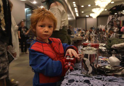RUTH BONNEVILLE /  WINNIPEG FREE PRESS

Patrick Rogers (5yrs) is dressed as spiderman as he checks out some neat toys  in the dealers room at KeyCon, SCI FI LITERARY CONVENTION  at  Radisson Hotel Saturday.   Keycon is Manitoba's premier Science Fiction & Fantasy Literary Convention. It focuses on science fiction, fantasy and related literary genres in any form.
May 20, 2017