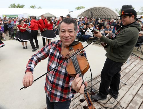 RUTH BONNEVILLE /  WINNIPEG FREE PRESS

Fiddler Clint Dutiaum plays while the Norman Chief Memorial Dancers perform at the opening of the St. Norbert Farmer's Market  Saturday morning. 

Standup


May 20, 2017