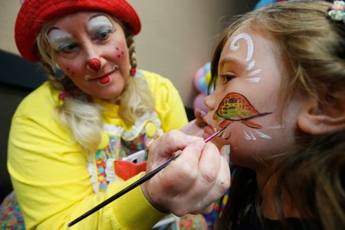 JOHN WOODS / WINNIPEG FREE PRESS
Dee Dee the clown, a.k.a. Deanna Hartmier, paints a multi-coloured turtle on Marley's face at the Family Expo & Kids Fair Sunday, May 21, 2017. The expo is donating part of it's profits to the local chapter of the Canadian Alopecia Areata Foundation (CANAAF)