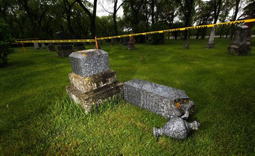 PHIL HOSSACK / WINNIPEG FREE PRESS  -   Toppled tombstones litter an older section of Brookside Cemetery Monday after wekend vandalism. See Jane Geerster's story.   -  May 22 2017