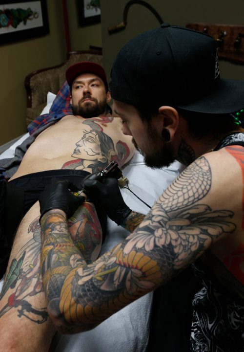 WAYNE GLOWACKI / WINNIPEG FREE PRESS 

 Keegan Misanchuk gets work on his side panel by tattooer Dan Fletcher at  Kapala Tattoo, St. Anne's Rd. Melissa Martin story   May 23 2017