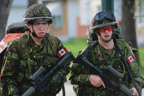 Canstar Community News May 16, 2017 - Members of the Fort Garry Horse walk the streets surrounding McGregor Armoury during a battle fitness training. (LIGIA BRAIDOTTI/CANSTAR COMMUNITY NEWS/TIMES)