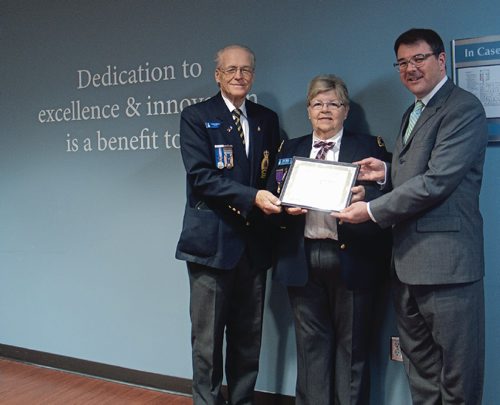 Canstar Community News May 17, 2017 - (From left) Gordon Machej, president of the Henderson Highway Legion Branch 215 and Lois Mills, head of Branch 215's Poppy Fund, receive a certificate Dr. Thomas Turgeon, director of arthoplasty research at Concordia Hospital's Hip and Knee Institute, acknowledging the Legion's financial contributions to the Institute. (SHELDON BIRNIE/CANSTAR/THE HERALD)