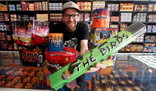 PHIL HOSSACK / WINNIPEG FREE PRESS - ARCHANGEL Firework's Sales Manager Matt Benzie poses with a selection of local explosives!! See Murray McNeill's story. - May 23, 2017