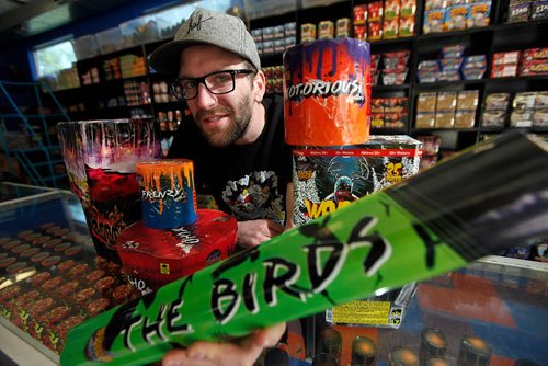 PHIL HOSSACK / WINNIPEG FREE PRESS  -  ARCHANGEL Firework's Sales Manager Matt Benzie poses with a selection of local explosives!! See Murray McNeill's story.    -  May 23, 2017