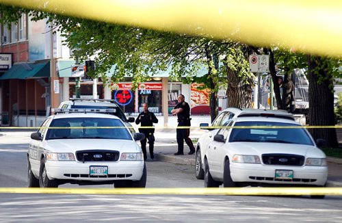 PHIL HOSSACK / WINNIPEG FREE PRESS  -  City police guard a "scene" on Kennedy between Ellice and Qu'Apelle street Tuesday evening near a cordoned off area of the block. Bystanders didn't know what led to the police presence.   -  May 23, 2017