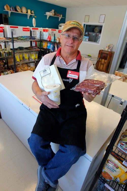 BORIS MINKEVICH / WINNIPEG FREE PRESS
Local Meats & Frozen Treats, 593 St. Anne's Rd.  Sunday Special feature on Ken Loney, 60, who opened Local Meats  & Frozen Treats after a long, long career in the TV repair biz. Here he sits on a freezer with some of the local products he sells. DAVE SANDERSON STORY. May 24, 2017